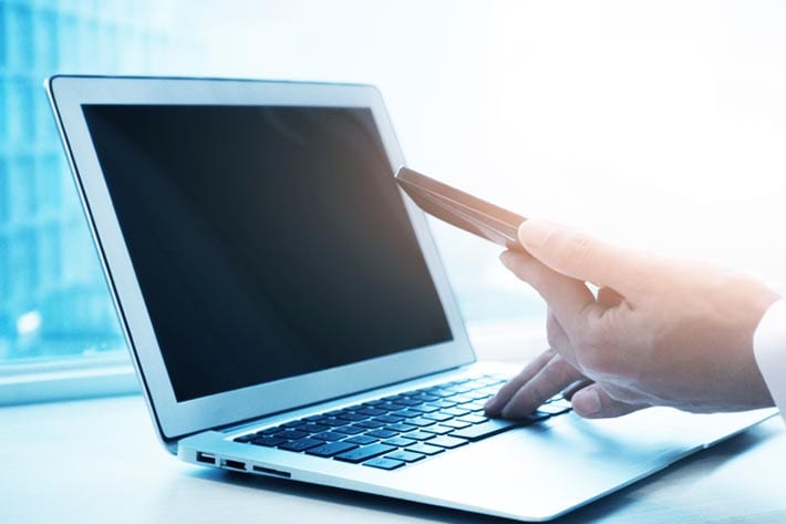 User on a laptop and mobile