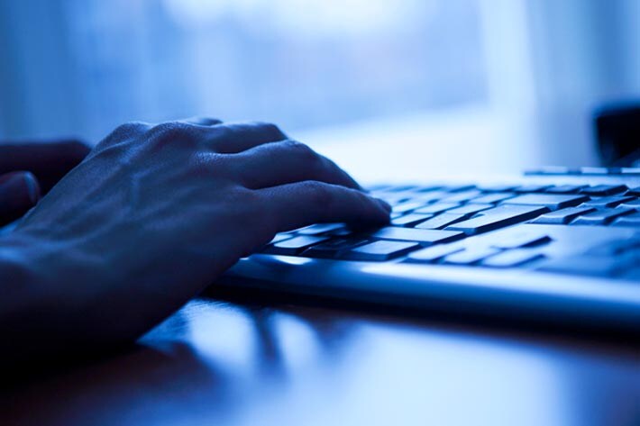 User typing on a keyboard